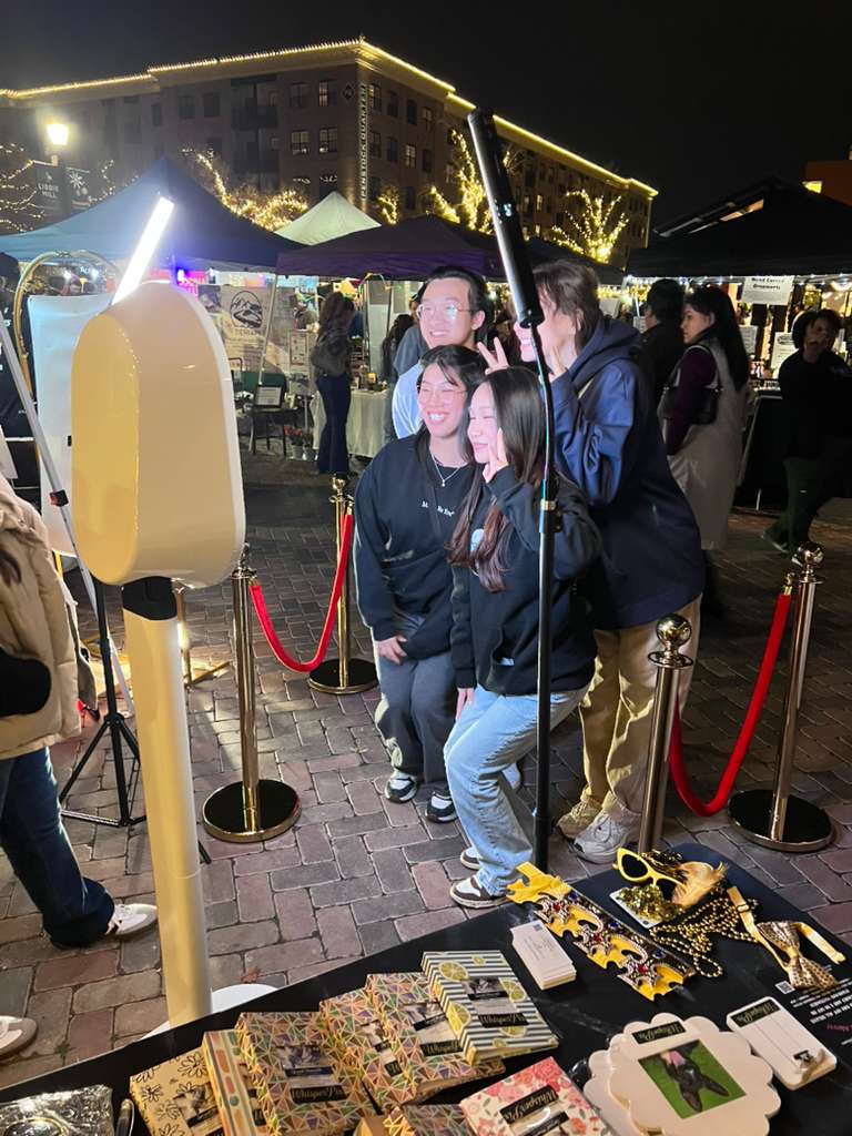 Guests using the Whisper Pix booth